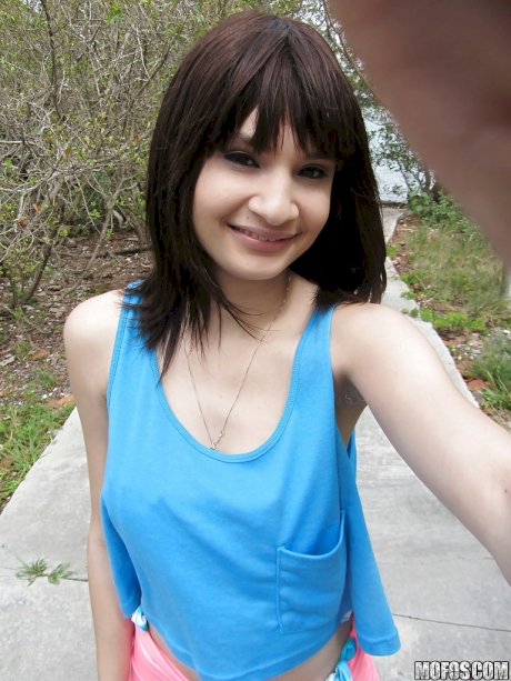 Latina babe Jessi Grey dose self shots of her tiny tits outdoor