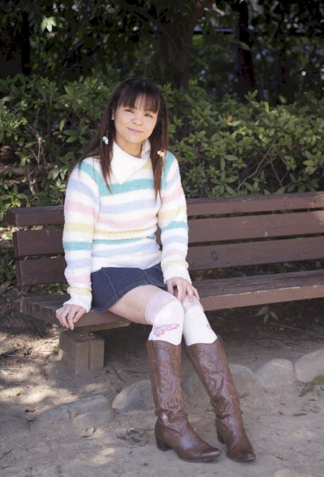 Young looking Asian girl Masami Kanno lifts up her sweater to expose herself