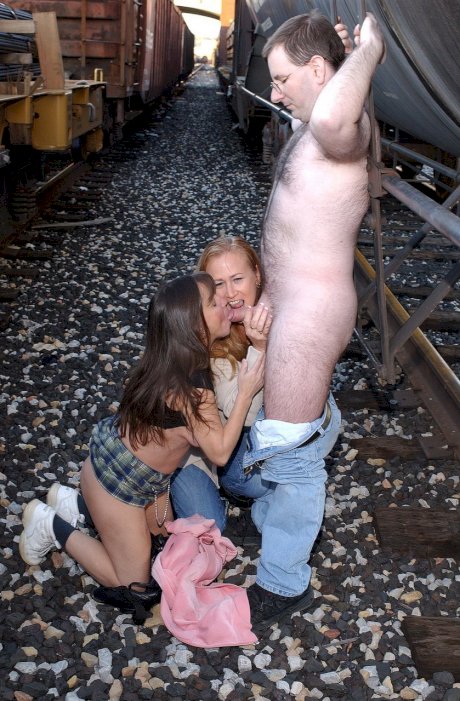 Amateur MILFs Tiger and Vixen suck a nerdy guy's cock in the rail yard