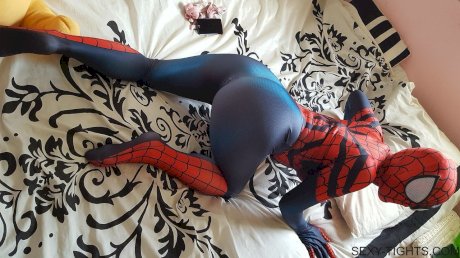 Cosplayer shows off her tight booty in a Spiderman costume on her bed