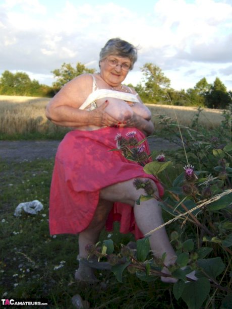 Obese oma Grandma Libby exposes her huge ass while in a field by a rural road