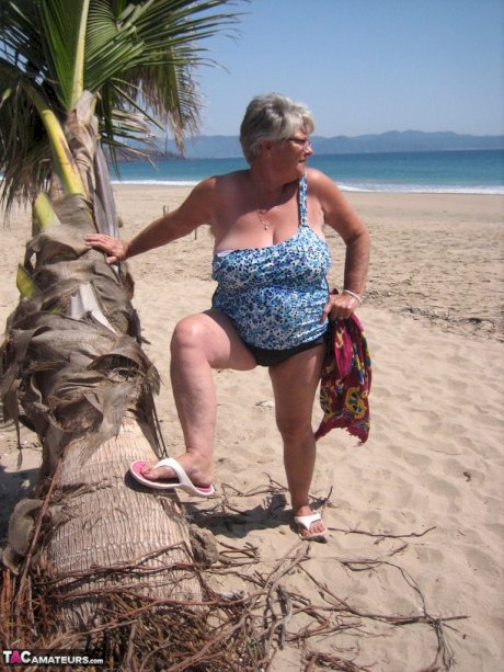 Fat granny Girdle Goddess takes off swimwear to pose nude at the ebach