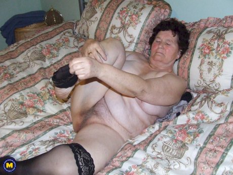 Old BBW Hildegard reveals her big naturals and hairy crotch in her bedroom