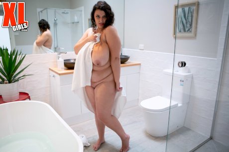 Obese woman Rose Blush gets totally naked before getting in bathtub