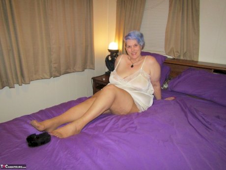 Fat granny Bunny Gram works free of handcuffs before sucking cock on her bed