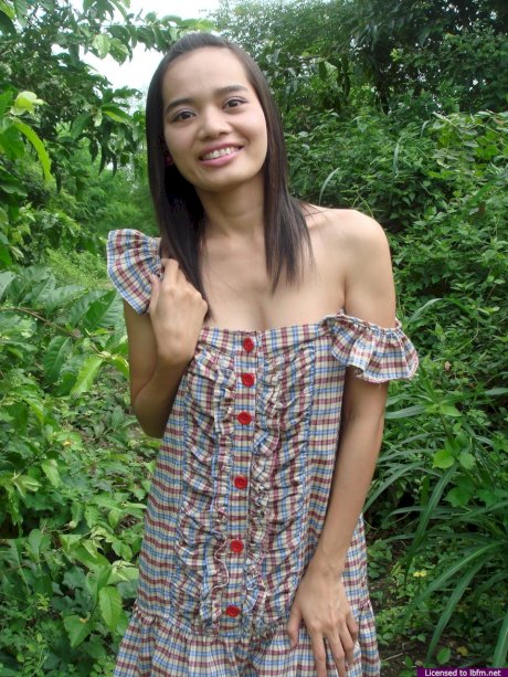 Young Asian girl gets in a vehicle after baring her tits and twat amid bushes