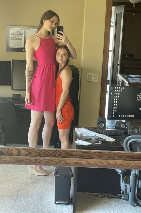 Tall lesbian Olivia does her short GF's hair & lets her toy with a vibrator