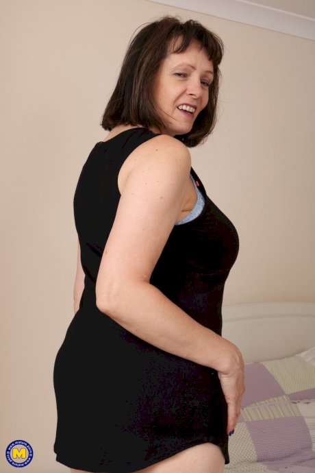 Fat granny slips out of her black dress and undies to air her big old tits