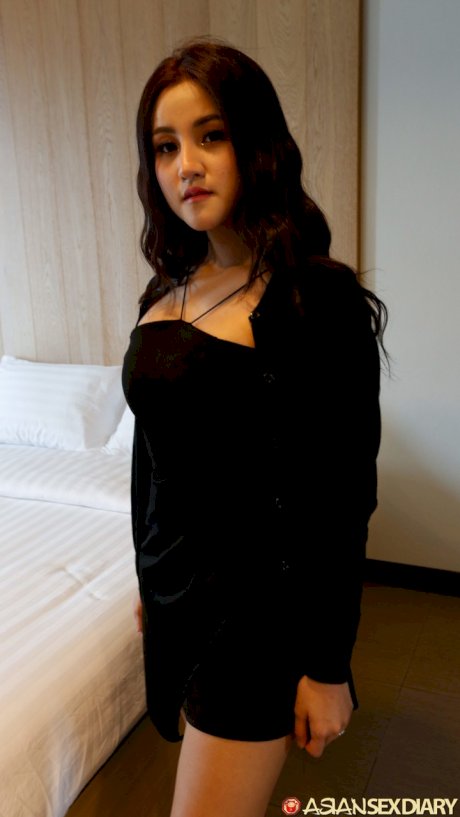 Beautiful Asian girl Zin shows her big tits while undressing for POV sex