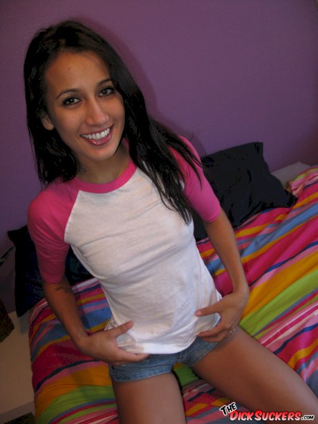 Slim Latina girl Amia Moretti disrobes to leg warmers and sneakers on her bed