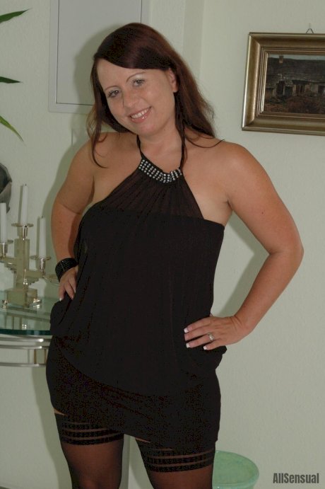 Thick brunette Benita uncovers her natural tits before upskirt action