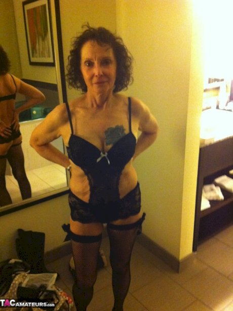 Curly haired mature woman likes sending her younger partner provocative photos