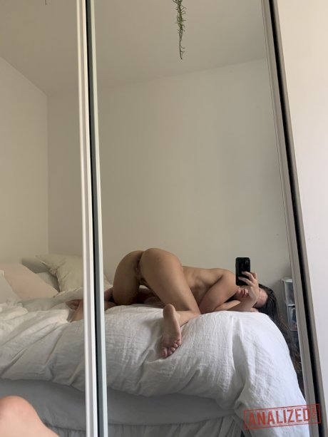 Brunette chick Abbie Maley grabs her bare ass after taking mirror selfies