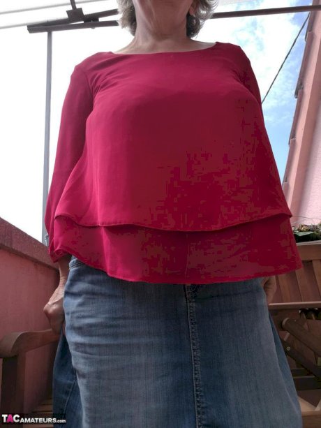 Horny oma spreads her upskirt pussy after pulling down her hose on patio