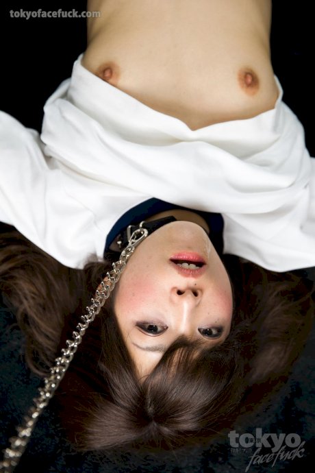 Asian sex slave is forced to give a messy blowjob while on her knees