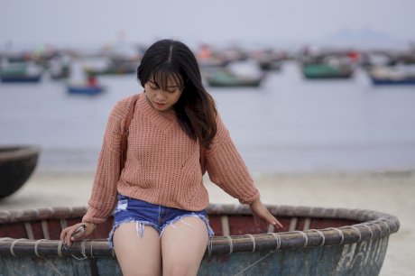 Stunning Asian babe poses in her jean shorts & sweater in public