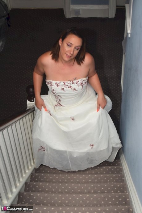 Amateur woman Sara Banks as her tits and pussy freed from a gown by two men