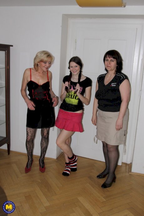 Two moms and one teen strip, cuddle and toy each other with a strapon