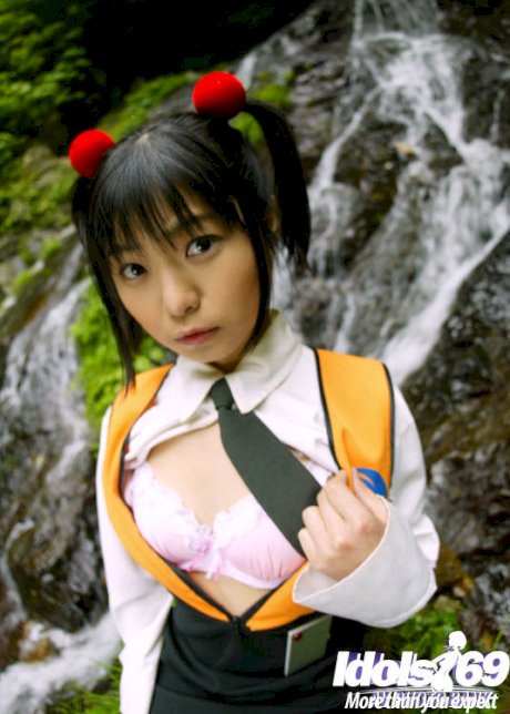 Smiley asian coed revealing her tiny titties and bushy cunt outdoor