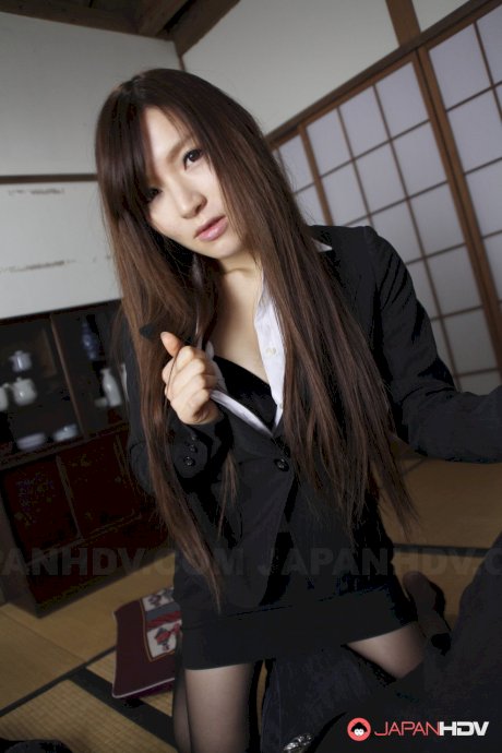 Japanese beauty Hitomi Tsukishiro sucks a cock before having her ass exposed