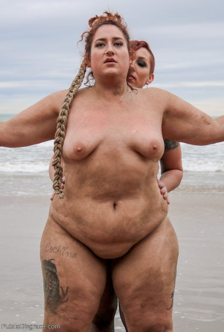 Slutty BBW Mimosa eats pussy while buried up to her neck in a kinky BDSM scene