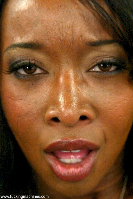 Beautiful ebony Stacey Cash strips and sits on a dildo machine in a solo