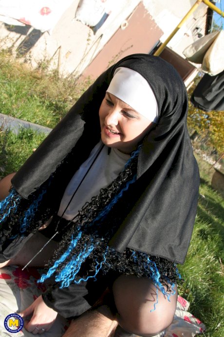 Horny nun in stockings Janine kneels to give a blowjob before outdoor sex
