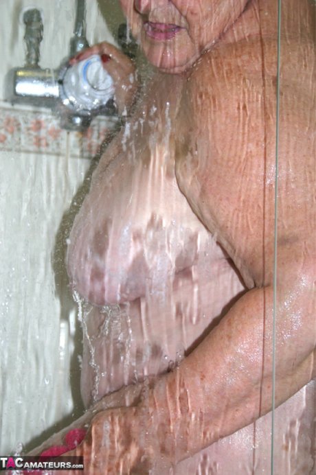 Obese granny Grandma Libby fondles her naked body while taking a shower