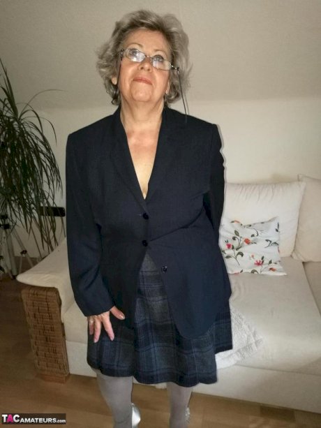 Old granny dildos her pussy in sheer nylons and garter ensemble