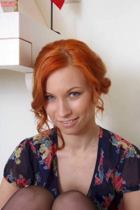 Beautiful redhead Daisy A shows her nice tits & her shaved cunt in stockings