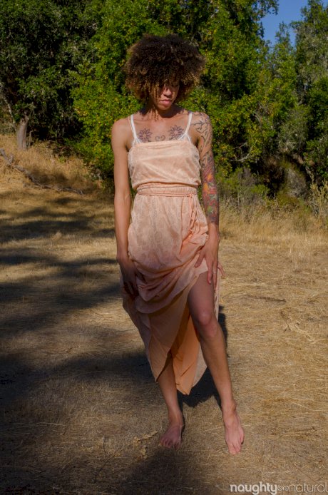 Exotic ebony Kendi Oh unveils her hairy tattooed body in nature