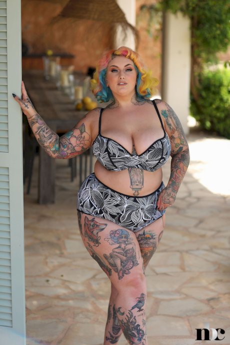 Fatty inked model with colorful hair Galda Lou stripping and posing nude