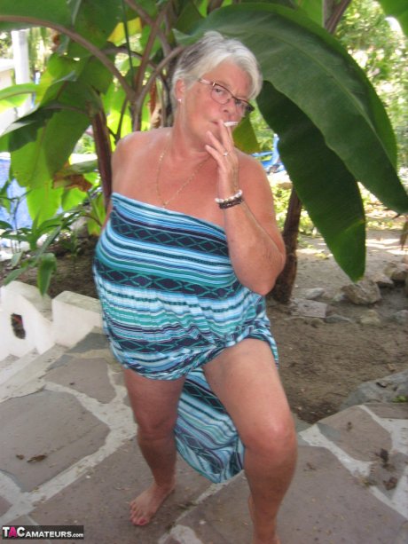 Old woman Girdle Goddess smokes before exposing her fat body on her patio