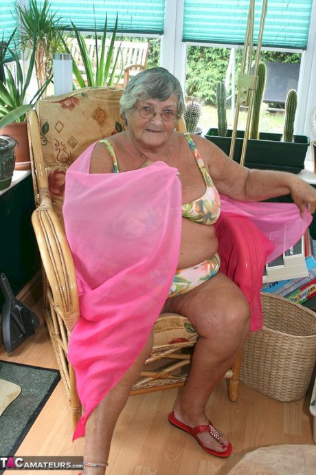 Horny old granny in glasses disrobes to reveal huge saggy tits & big BBW ass
