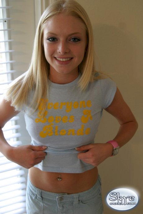 Blonde amateur Skye Model models by herself in a short skirt