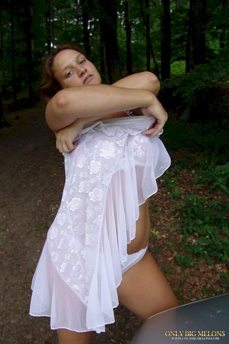 Young solo girl Jana Kucova releases her huge boobs near a forest