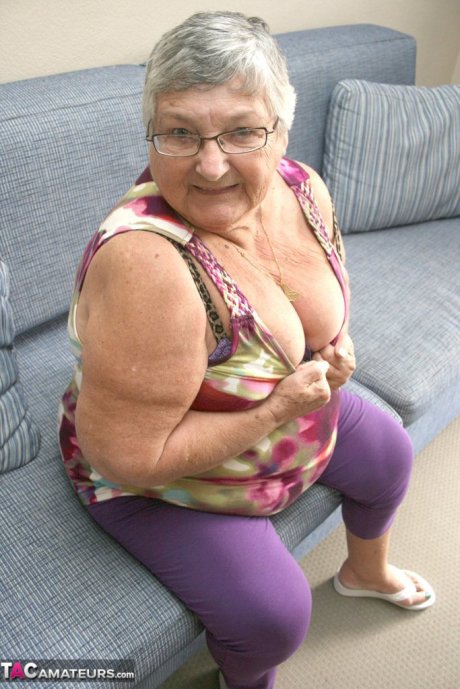 Huge fatty granny baring her saggy boobs & spreading her horny pussy wide open