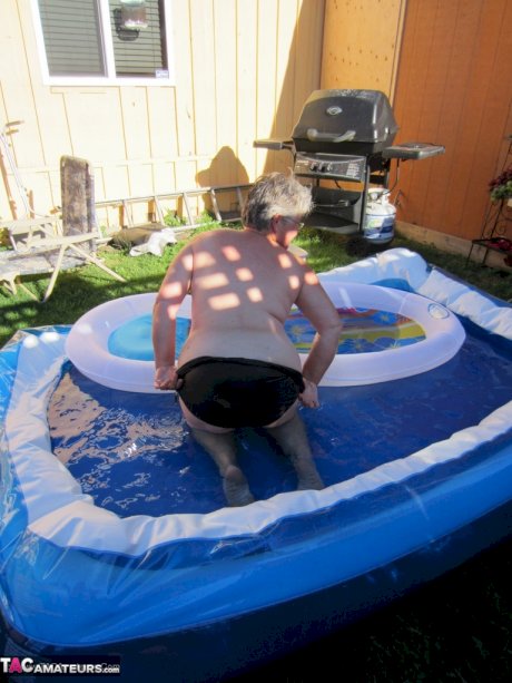 Fatty mature granny Girdle Goddess peels to enjoy wading pool skinny dip