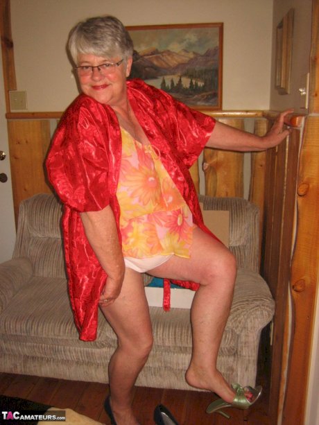 Obese granny Girdle Goddess wakes up from a nap and precedes to strip naked