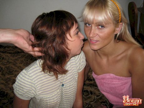 Young girls share a kiss before commencing on a POV threesome