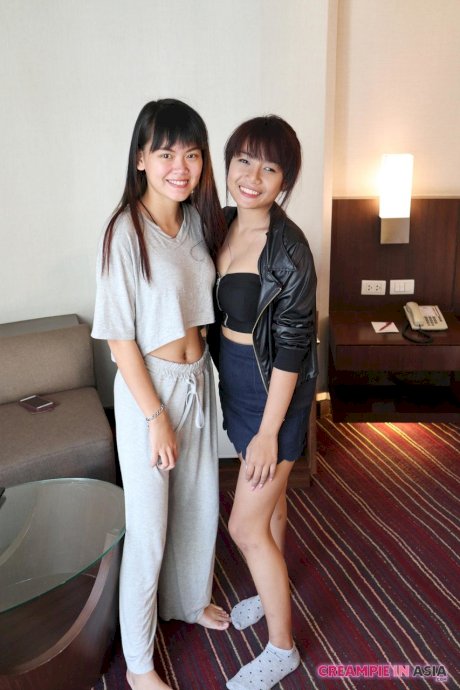 Petite Asian amateurs Sprite and Mon strip and pose naked together