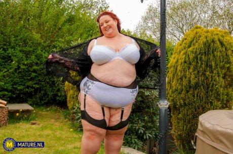 Morbidly obese older redhead dildos her snatch in a garter belt and nylons