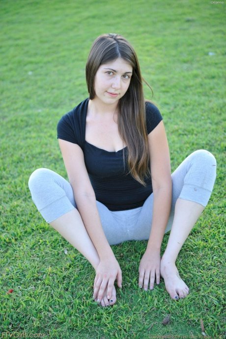 Amateur cutie with glasses Orianna gets naked while doing exercises outdoors