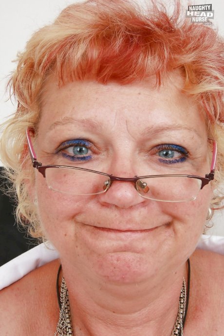 Filthy granny in nurse uniform stretching her twat by her fingers