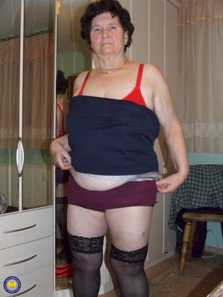 Old BBW Hildegard reveals her big naturals and hairy crotch in her bedroom