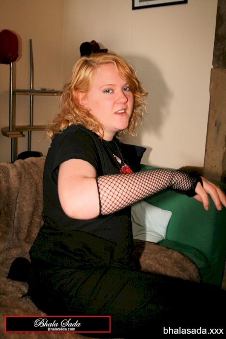 Redheaded fatty strips her sweatshirt and shows her cleavage in a black bra