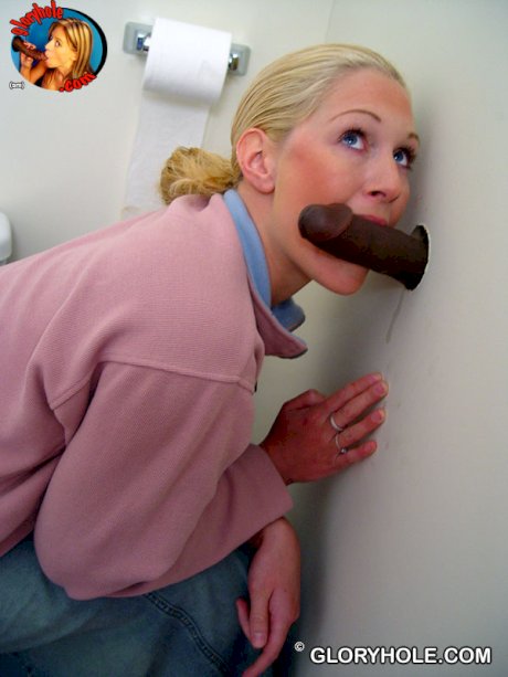 Blonde girl Jamie sits on the toilet and blows a black gloryhole dong