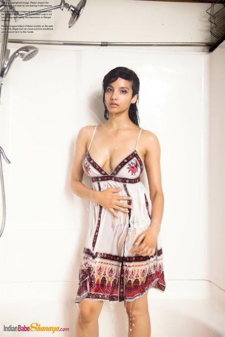 Indian solo girl takes off her wet dress to pose nude in the bathtub