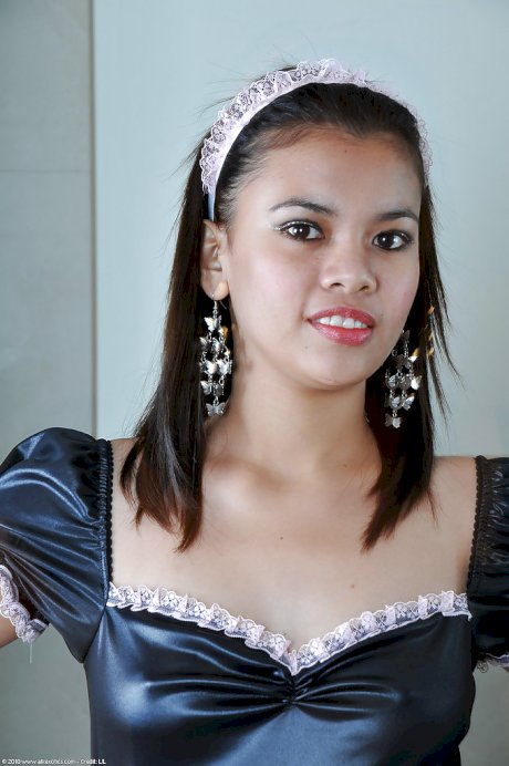 Petite Asian chick Clarice modelling solo in sexy French maid uniform