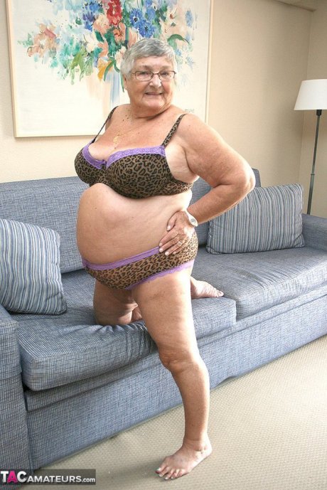Huge fatty granny baring her saggy boobs & spreading her horny pussy wide open